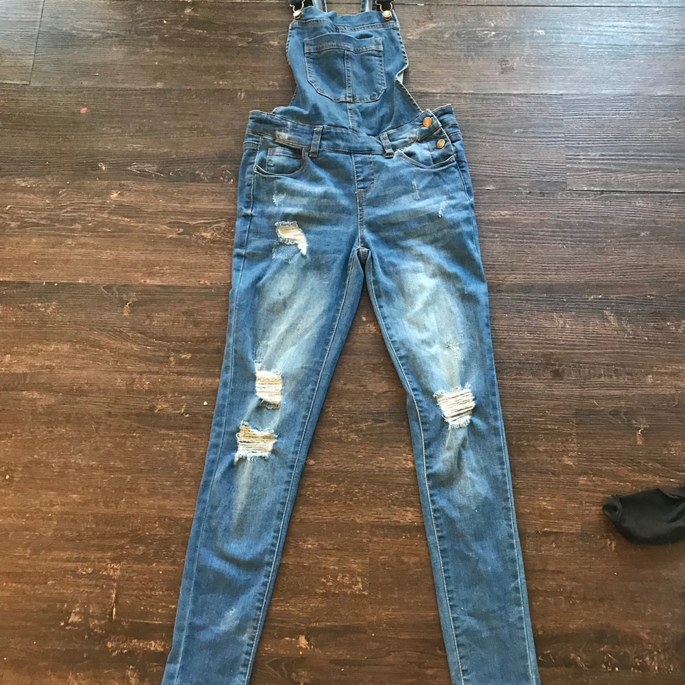 Woman’s ripped jegging overalls
